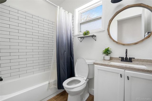 full bathroom featuring vanity, hardwood / wood-style floors, shower / bath combination with curtain, and toilet