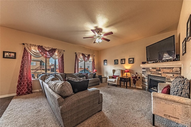 12420 Mount Belford Way, Peyton, CO 80831 - carpeted living area featuring ceiling fan, a fireplace, a textured ceiling, and baseboards