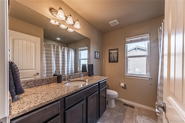 12420 Mount Belford Way, Peyton, CO 80831 - full bath featuring vanity, toilet, baseboards, and tile patterned flooring