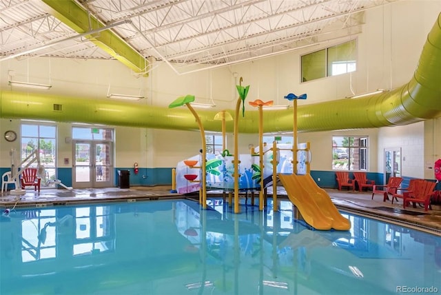 12420 Mount Belford Way, Peyton, CO 80831 - indoor pool featuring french doors