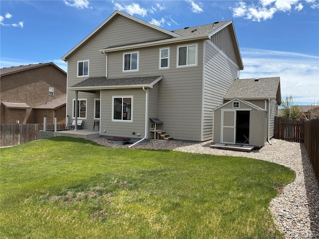 12420 Mount Belford Way, Peyton, CO 80831 - back of property with board and batten siding, roof with shingles, and a patio