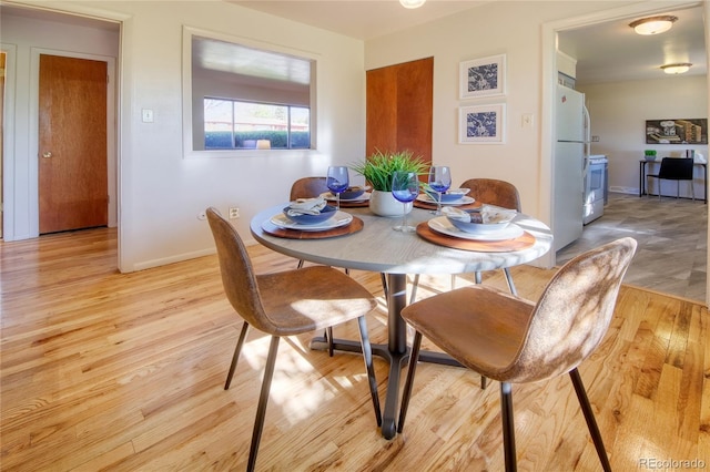 1227 Holmes Dr, Colorado Springs, CO 80909 - dining space featuring light wood-type flooring and baseboards