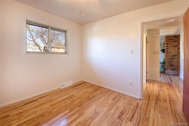 1227 Holmes Dr, Colorado Springs, CO 80909 - unfurnished room with light wood-style flooring and baseboards