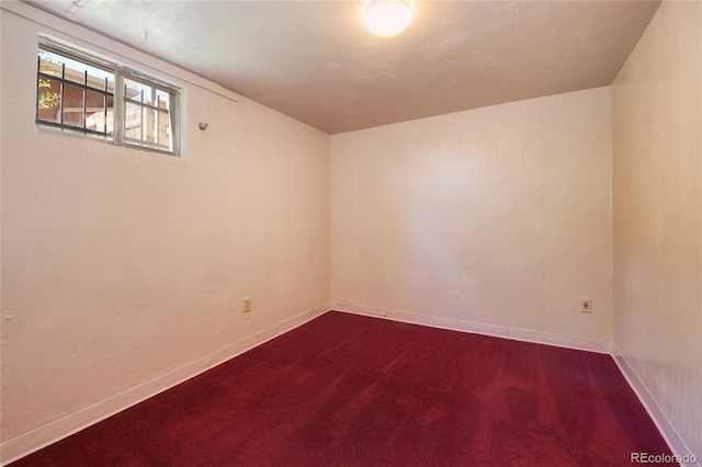 1227 Holmes Dr, Colorado Springs, CO 80909 - unfurnished room with dark carpet and baseboards