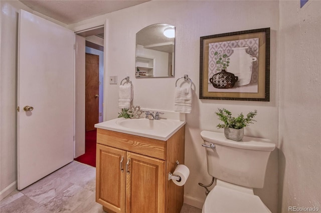 1227 Holmes Dr, Colorado Springs, CO 80909 - half bath featuring toilet, vanity, and baseboards