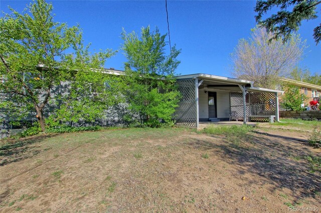 1227 Holmes Dr, Colorado Springs, CO 80909 - view of rear view of property