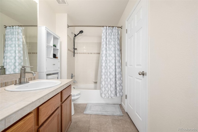 bathroom with vanity, toilet, shower / bath combo, and tile patterned flooring