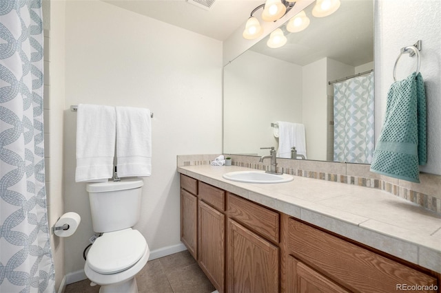 full bath featuring toilet, tile patterned floors, visible vents, baseboards, and vanity