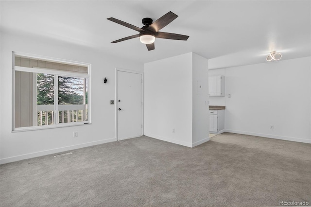 7902 Chase Cir Unit 152, Arvada, CO 80003 - unfurnished living room with a ceiling fan and light colored carpet