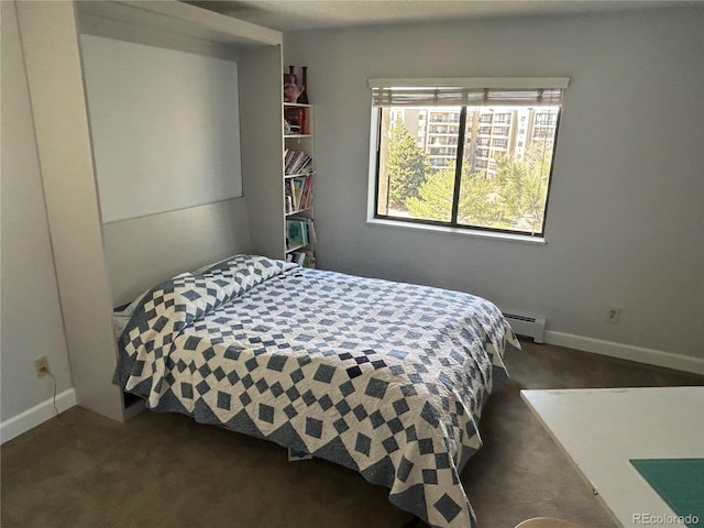 bedroom with baseboard heating, carpet flooring, and baseboards
