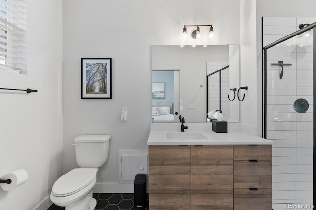 bathroom with tile patterned flooring, vanity, walk in shower, and toilet