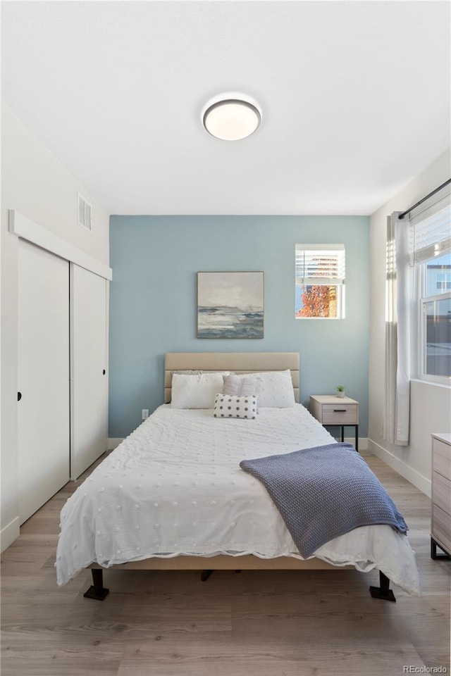 bedroom featuring light hardwood / wood-style flooring