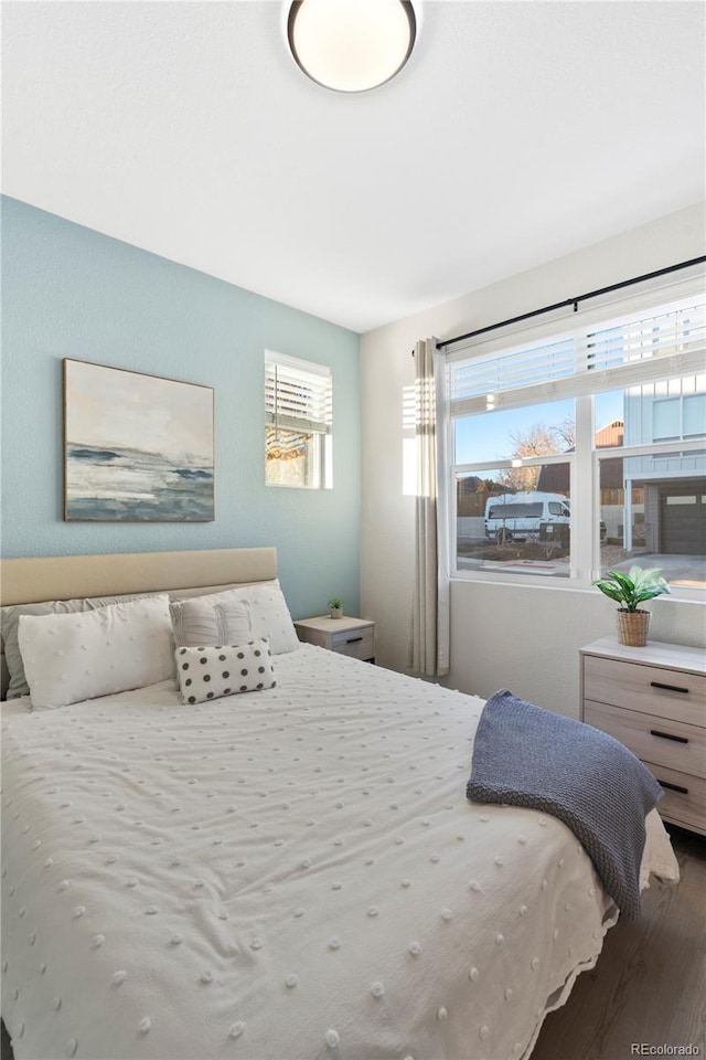 bedroom with hardwood / wood-style floors