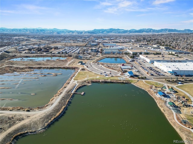 bird's eye view with a water and mountain view