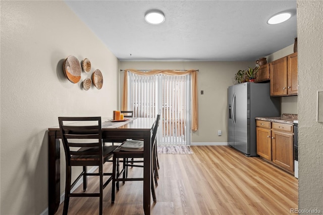 dining room featuring light hardwood / wood-style floors