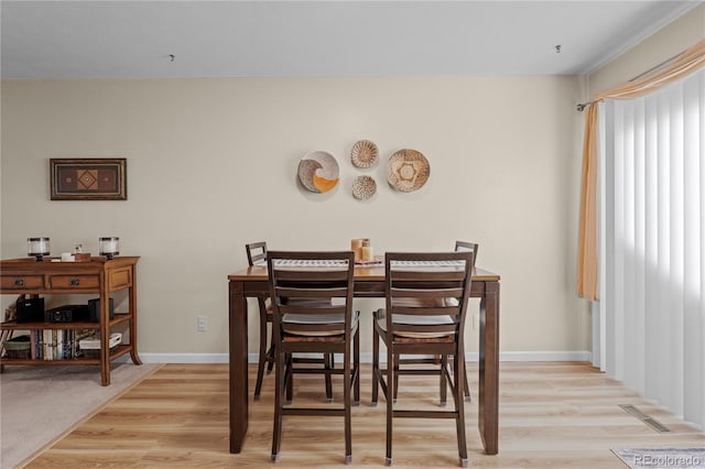 dining space featuring light hardwood / wood-style flooring