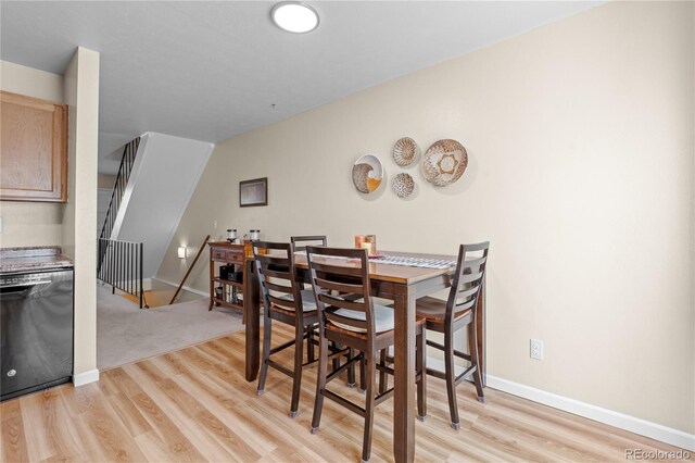 dining area with light hardwood / wood-style floors