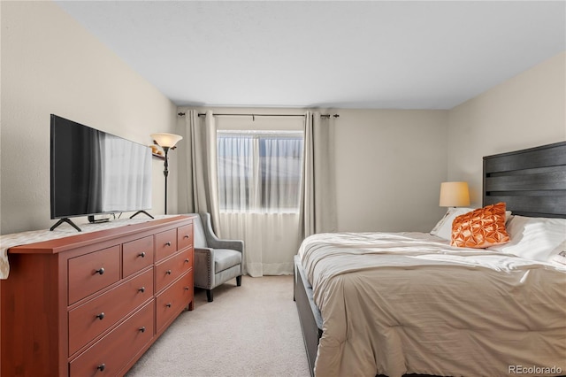 bedroom with light colored carpet