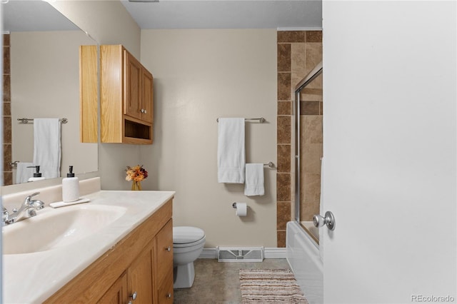 full bathroom with vanity, toilet, bath / shower combo with glass door, and tile patterned floors