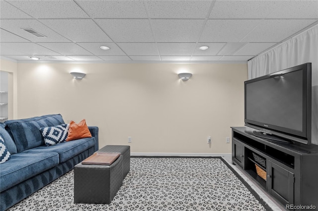 living room with a paneled ceiling