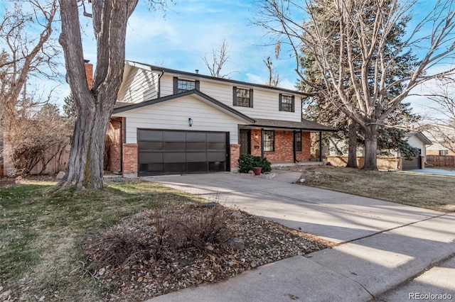 traditional home featuring a garage, brick siding, fence, concrete driveway, and a front yard