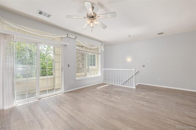 1535 S Florence Way Unit 410, Aurora, CO 80247 - empty room with wood finished floors and ceiling fan