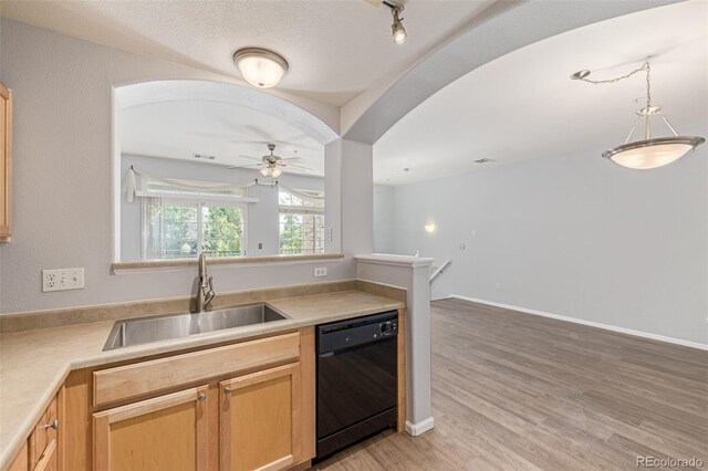 1535 S Florence Way Unit 410, Aurora, CO 80247 - kitchen with dishwasher, ceiling fan, light wood finished floors, and light countertops