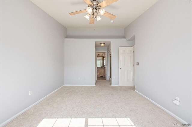 1535 S Florence Way Unit 410, Aurora, CO 80247 - unfurnished bedroom featuring light carpet, ensuite bathroom, and a ceiling fan