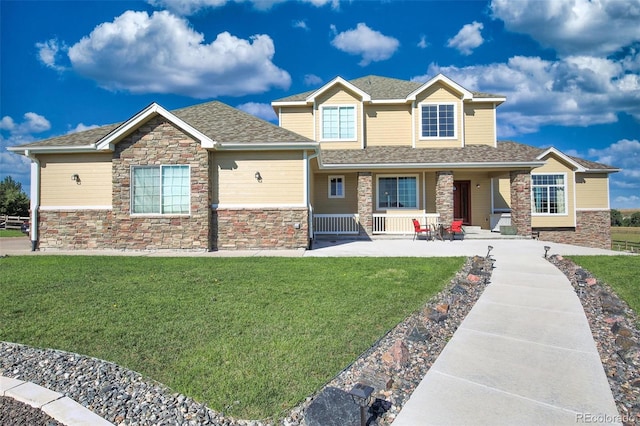 craftsman-style home featuring a front yard