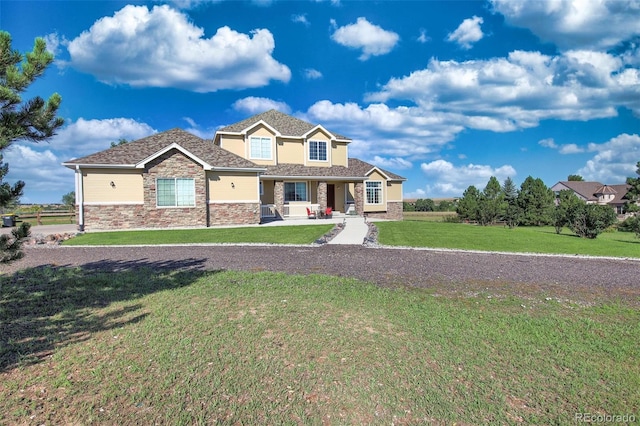 craftsman house with a front lawn