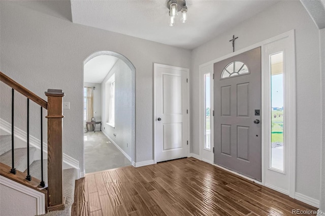 foyer with dark hardwood / wood-style flooring