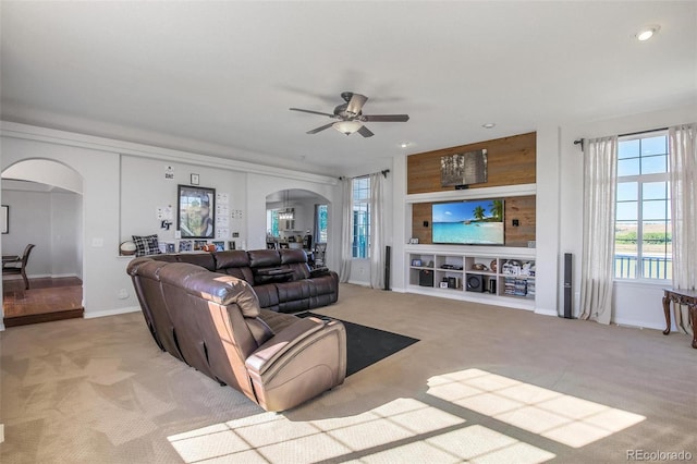 living room featuring ceiling fan and light carpet