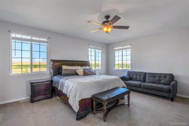 bedroom with ceiling fan and carpet