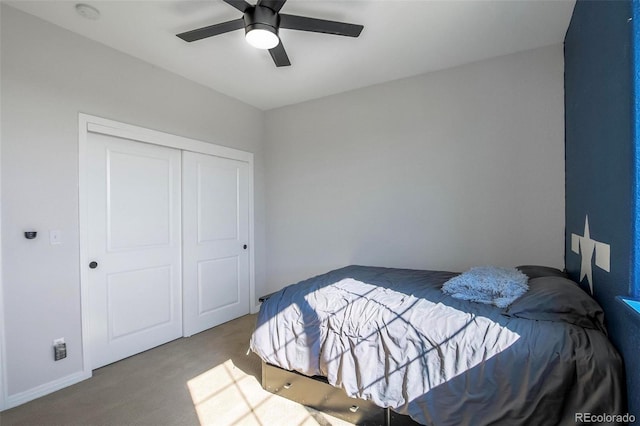 bedroom with carpet flooring, a closet, and ceiling fan