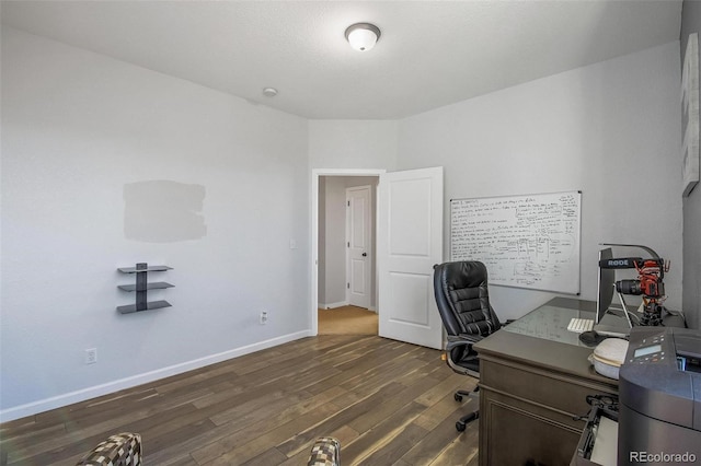 office with dark hardwood / wood-style floors