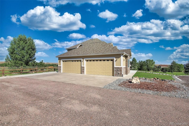 view of side of home with a garage