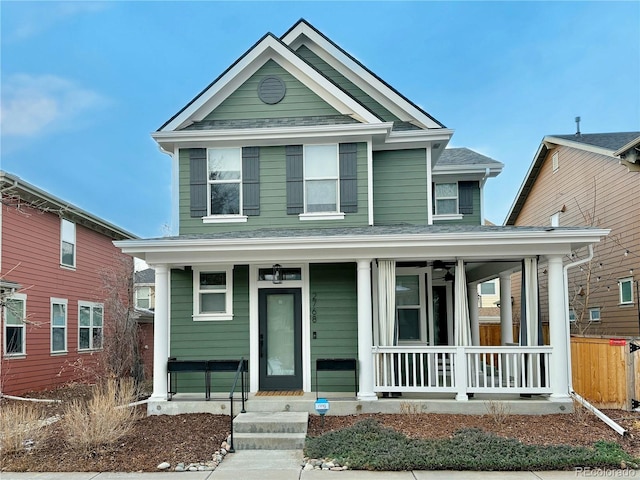 view of front of house with covered porch and a shingled roof