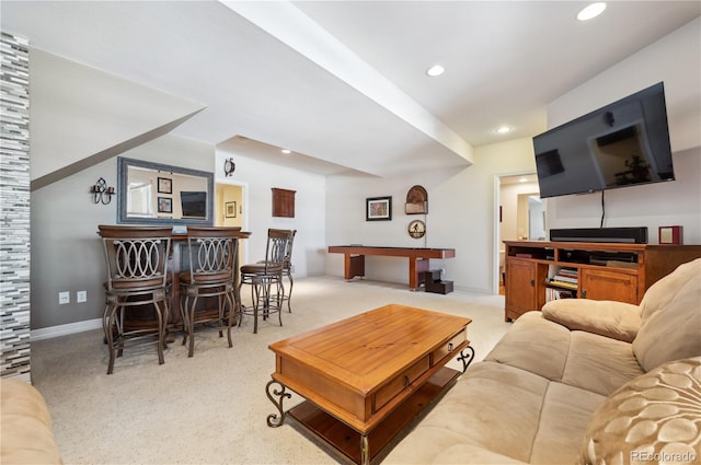 living room with recessed lighting, a bar, baseboards, and carpet floors