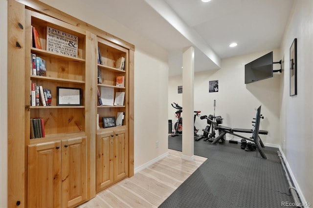 exercise area featuring recessed lighting and baseboards