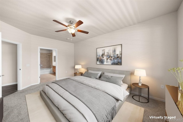 bedroom featuring carpet, baseboards, ensuite bath, and a ceiling fan