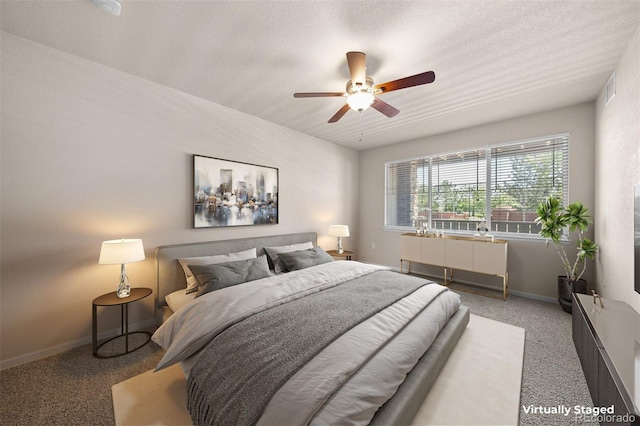 bedroom featuring carpet, baseboards, and ceiling fan