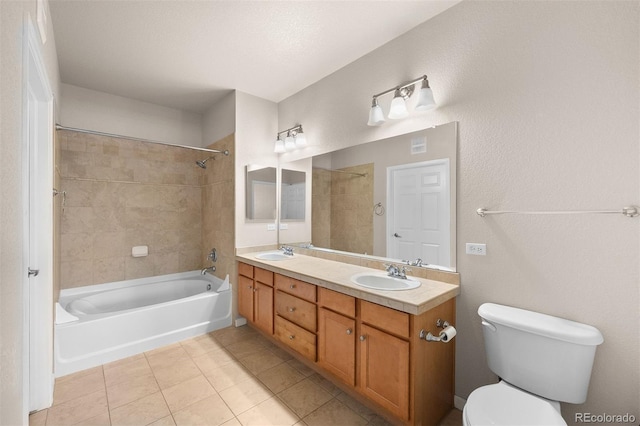 bathroom featuring tile patterned floors, toilet, washtub / shower combination, and double vanity