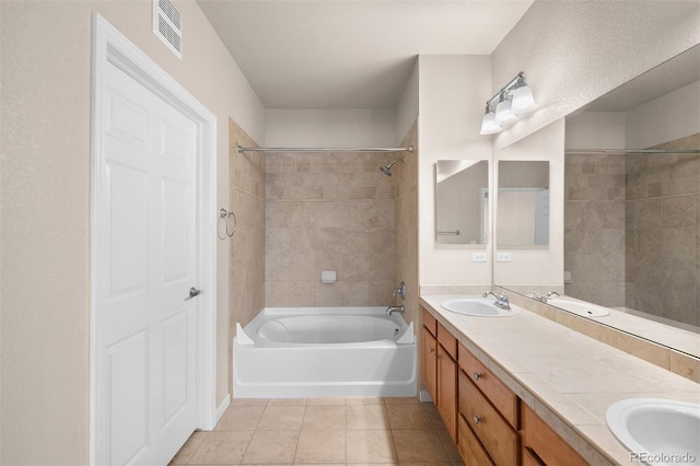 bathroom with tile patterned flooring, washtub / shower combination, and double vanity