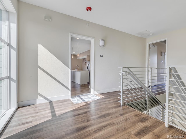 interior space featuring hardwood / wood-style flooring and sink