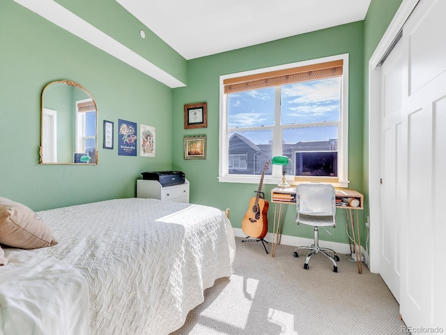 bedroom featuring a closet and carpet