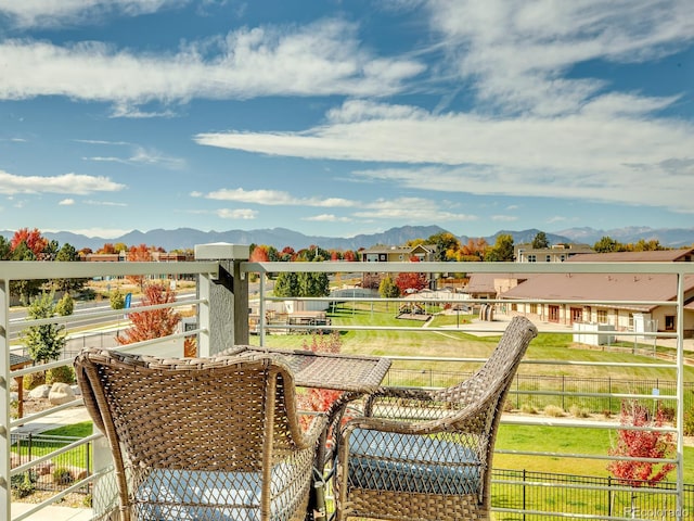 balcony featuring a mountain view