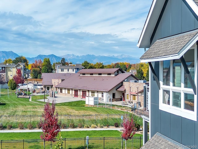 exterior space featuring a mountain view and a yard