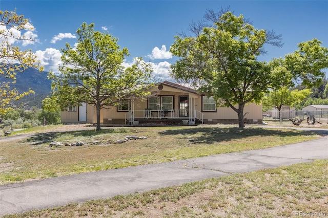 246 Loop Dr, Howard, CO 81233 - view of front of house with a porch and crawl space