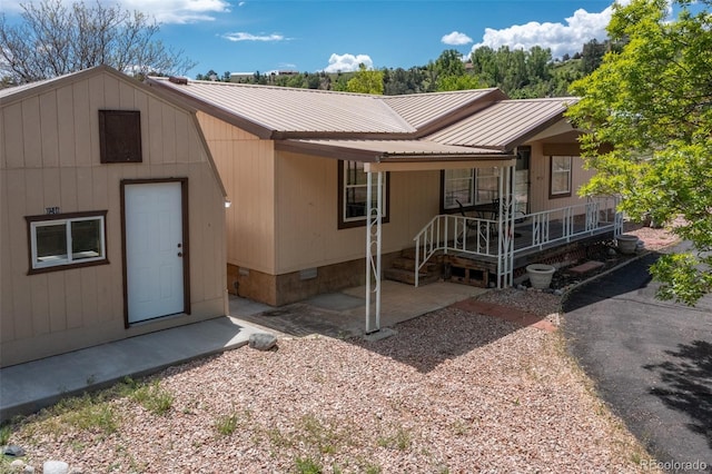 246 Loop Dr, Howard, CO 81233 - view of front facade featuring crawl space and metal roof