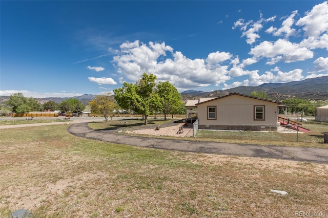 246 Loop Dr, Howard, CO 81233 - view of home's exterior with a mountain view and a yard